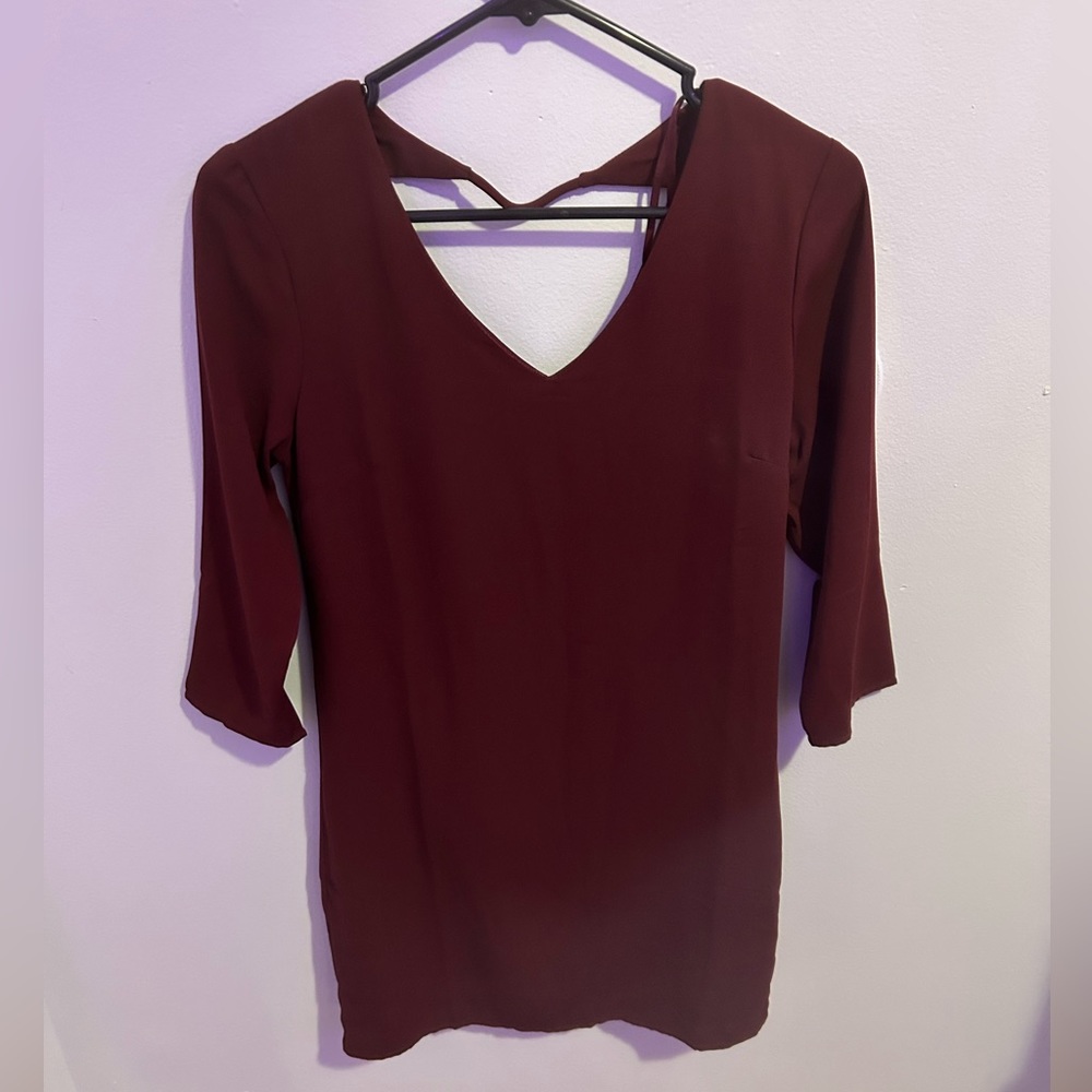 small gently loved long sleeve burgundy dress with a v neck on both sides